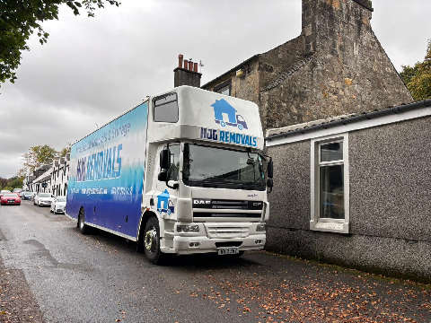 HJG Truck in front of a House